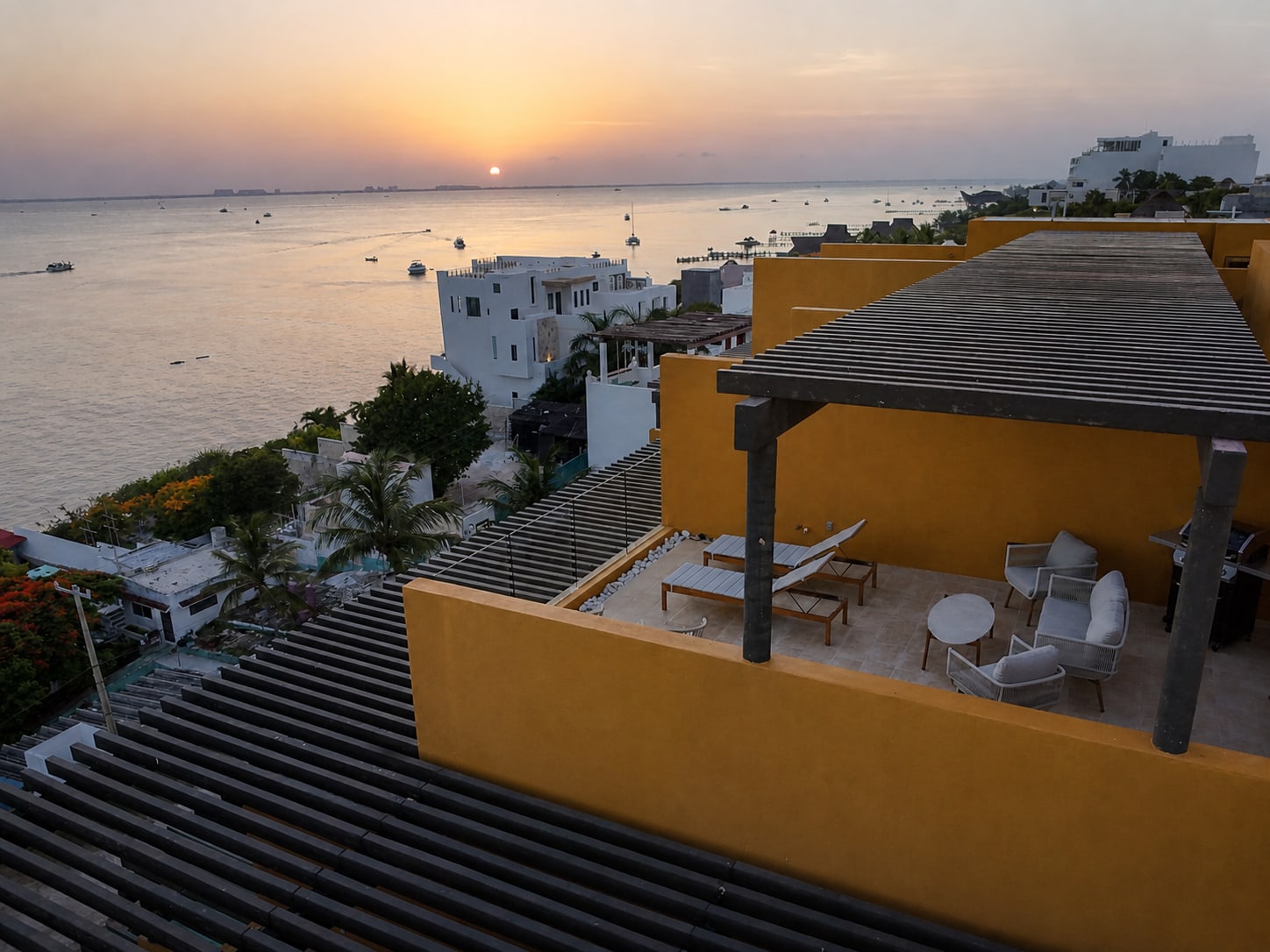 Sunset over the bay from the private rooftop terrace at Casa Solaz