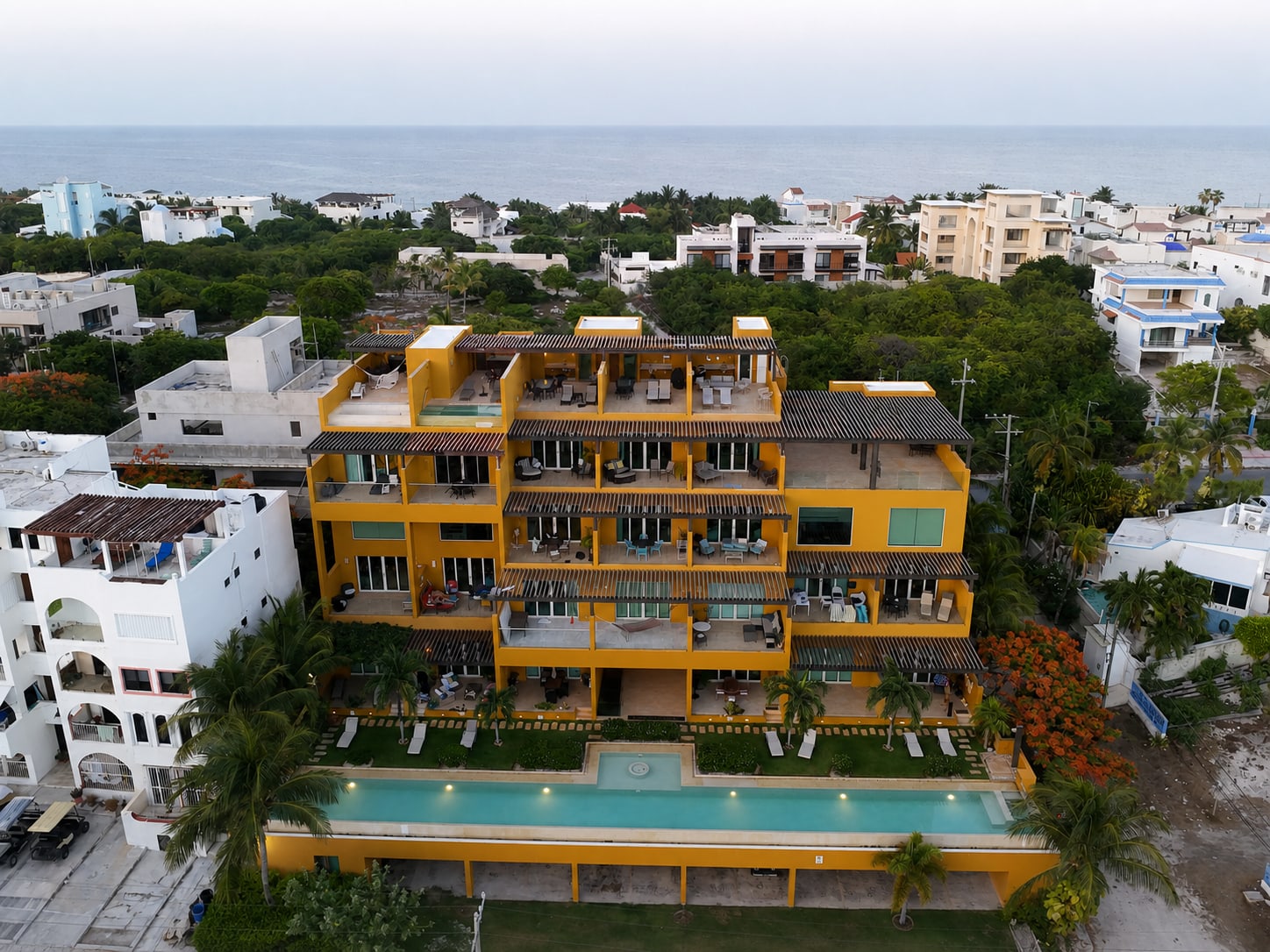 Aerial view of Sotavento with the pool and rooftop terraces on Isla Mujeres
